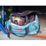 +VAT Tool bag containing various DeWalt tools including nailer, radio, circular saw, etc