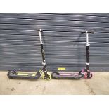 1 pink and 1 green scooter