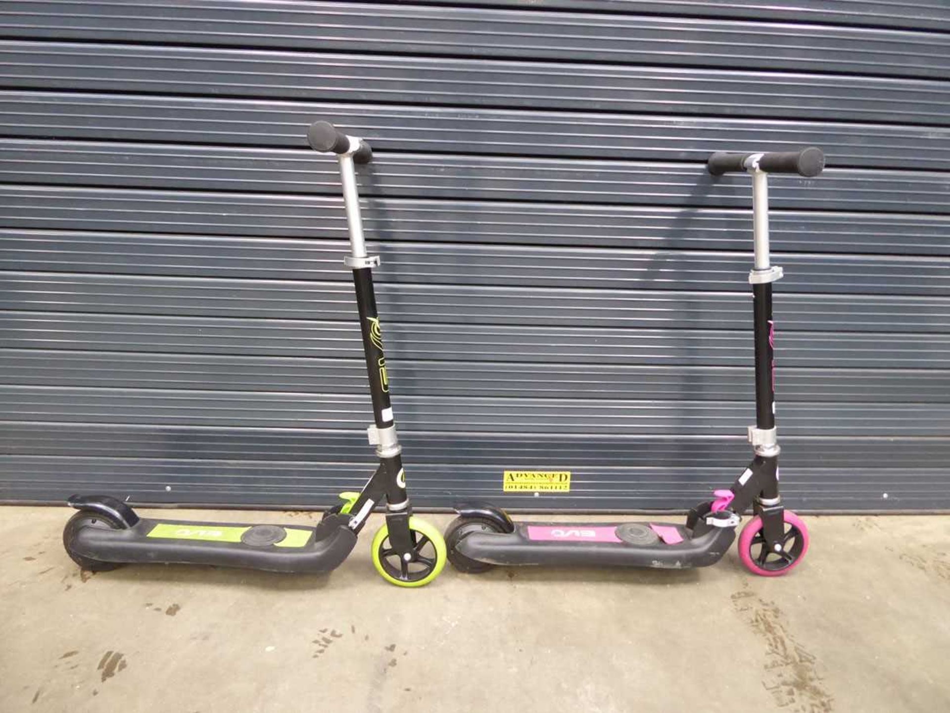 1 pink and 1 green scooter
