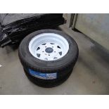 2 white trailer wheels with tyres