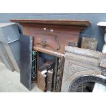 Cast iron fire surround with black tiled back and hearth