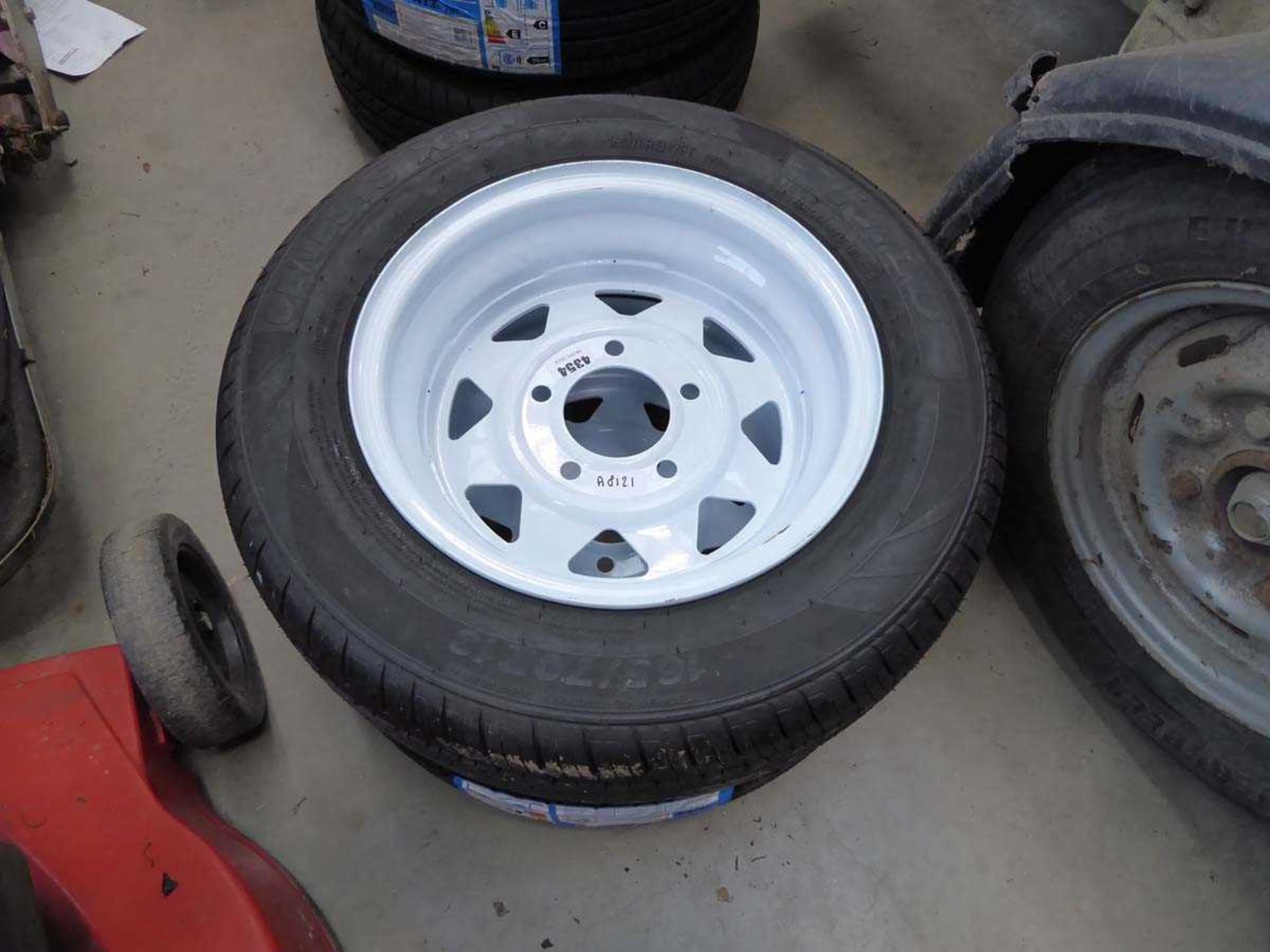 2 white trailer wheels with tyres