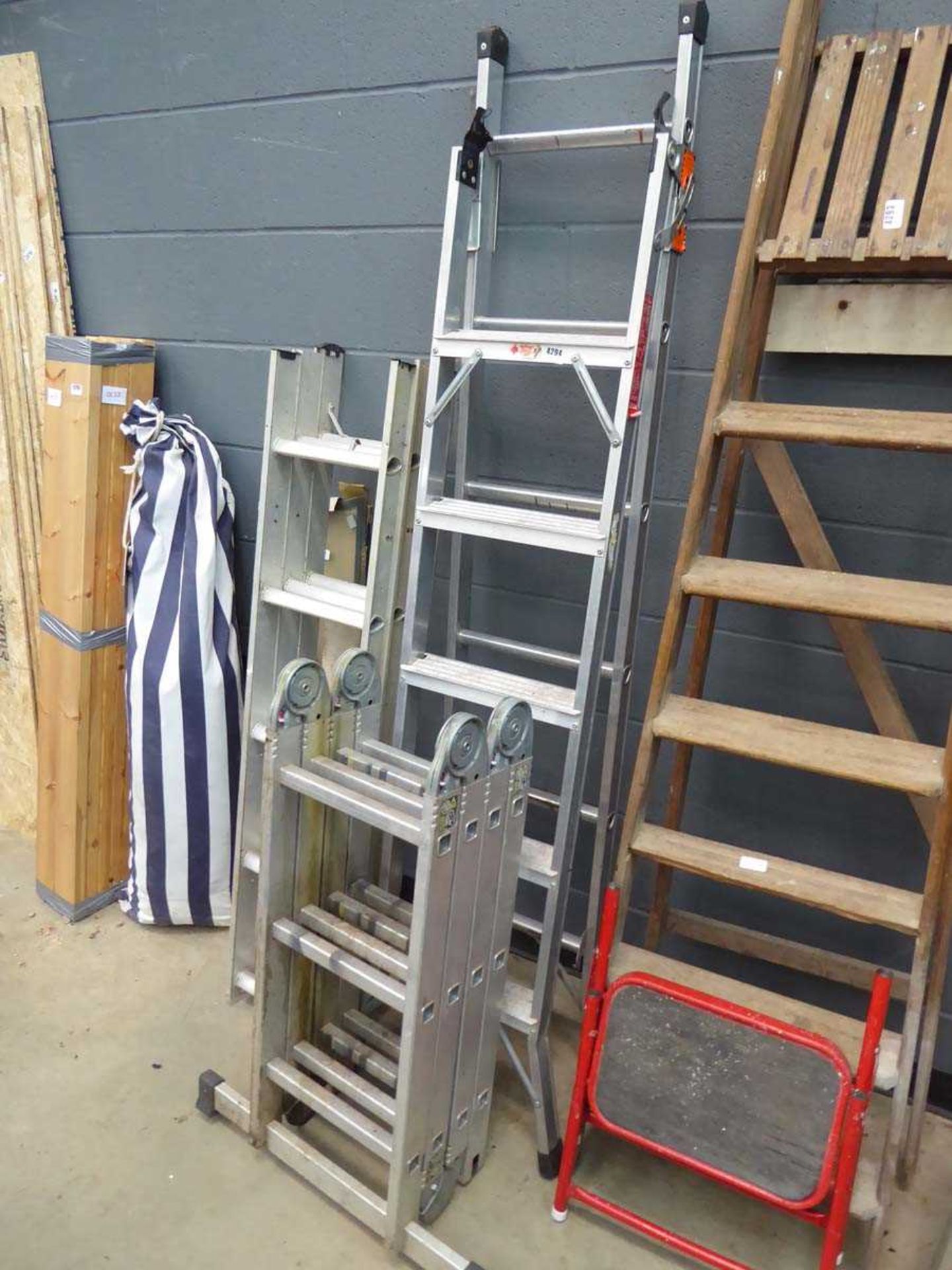 Multi position ladder, a step ladder, and a loft ladder