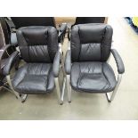 2 black slide frame chairs