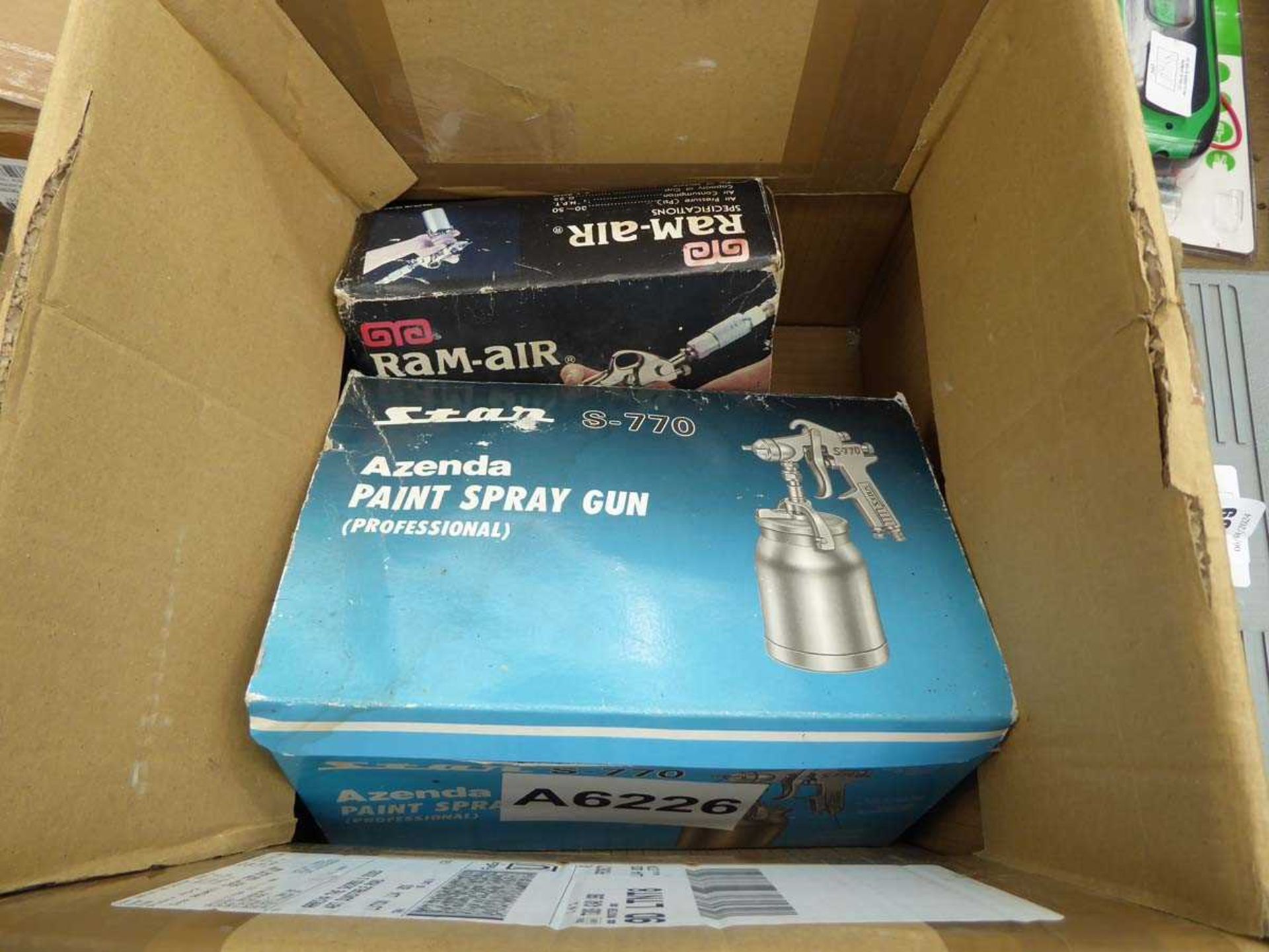 Box containing spray guns