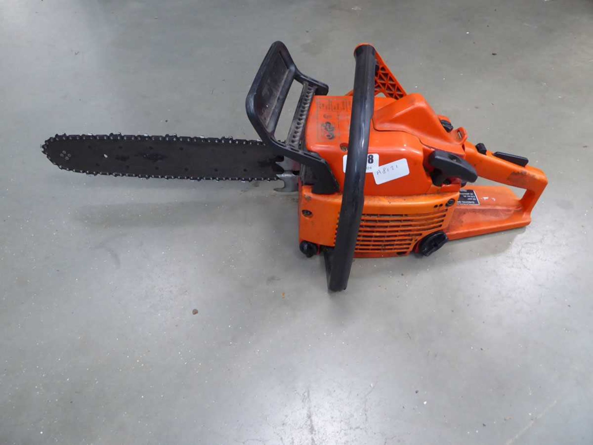 Orange Sachs Dolmar petrol powered chainsaw