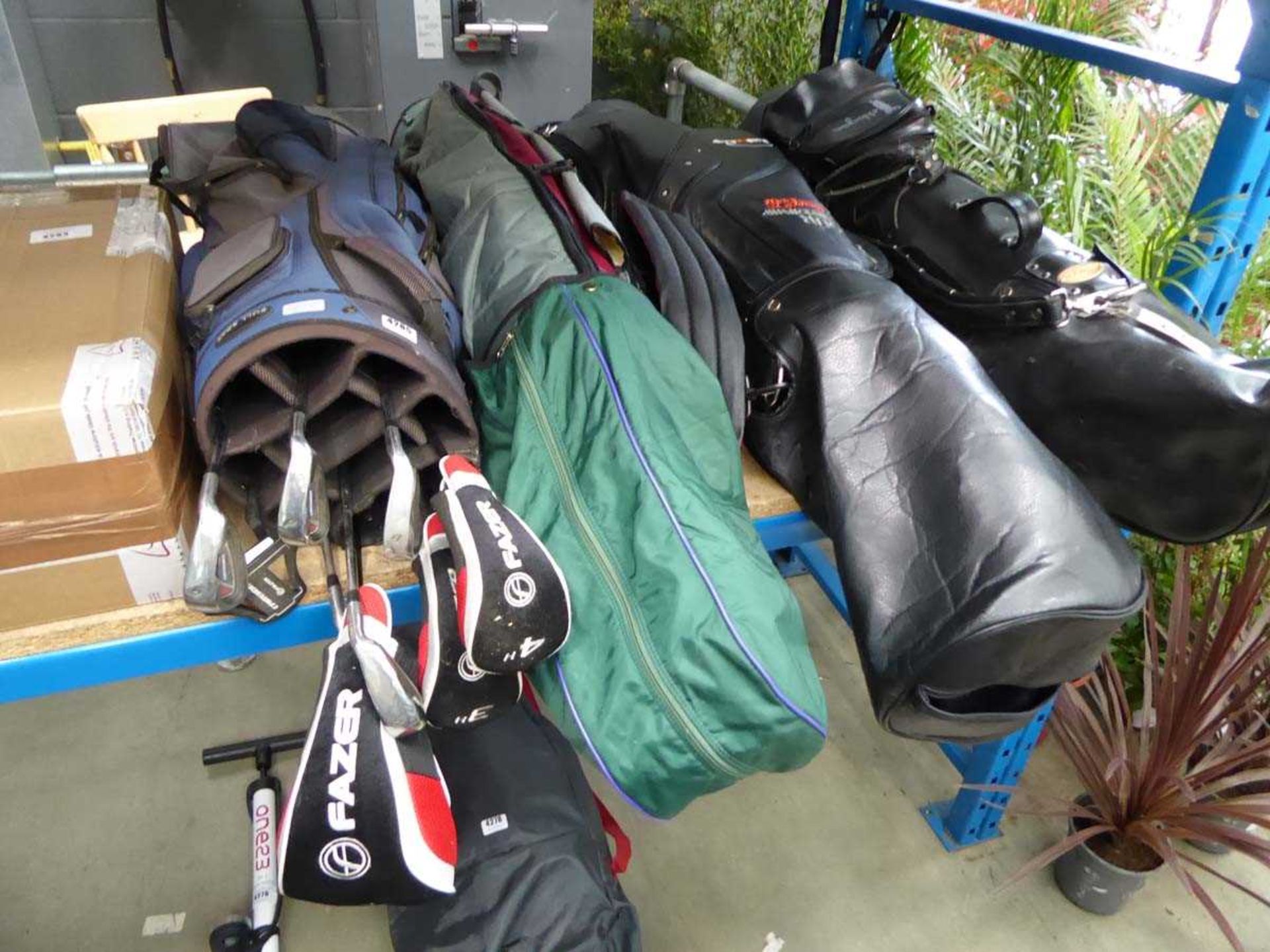 4 x bagged sets of golf clubs