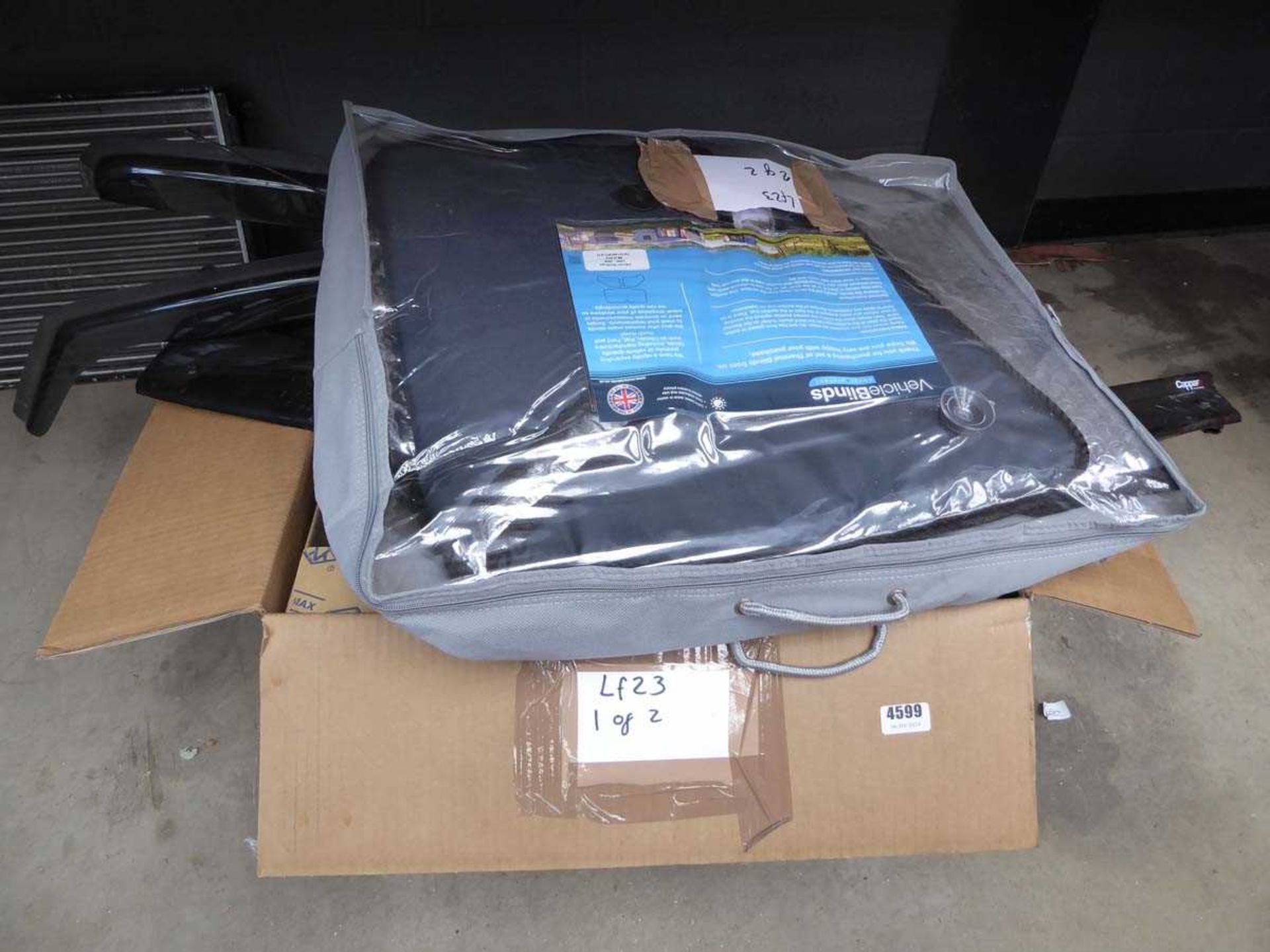 Box of car parts, accessories and a vehicle blind