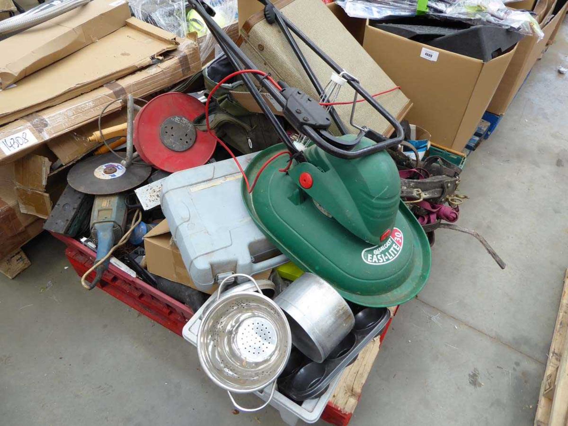 Pallet containing angle grinders, sanders, chains, extension cable, sieves, hover mower, horse tack,