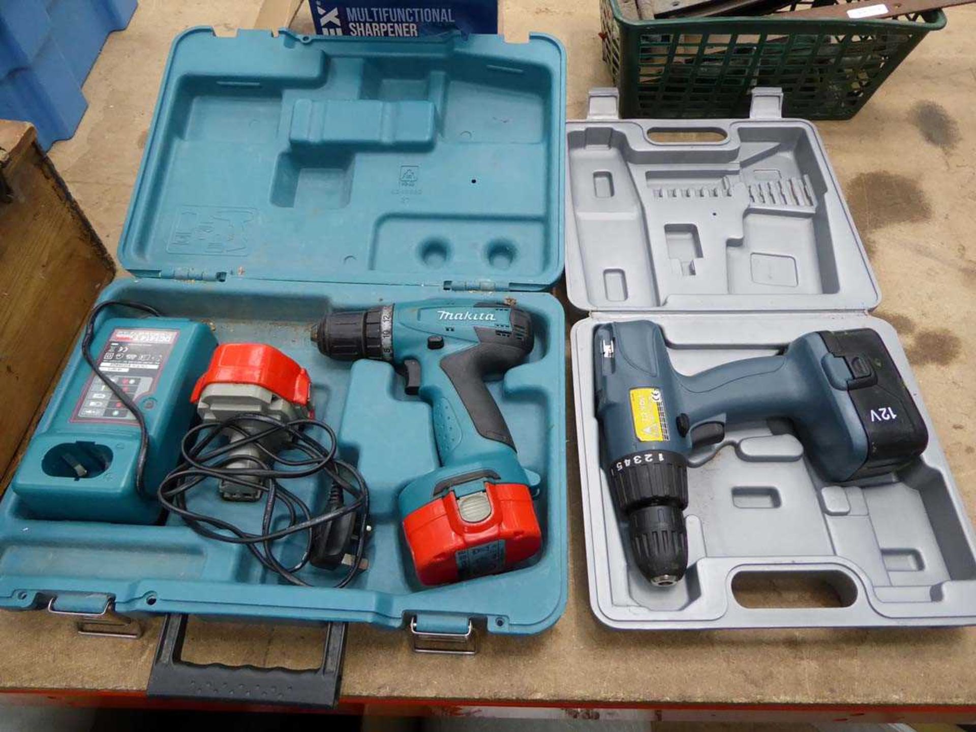 Makita battery drill, two batteries and charger and a small battery drill, one battery, no charger