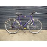 Purple Peugeot gent's bike with back rack