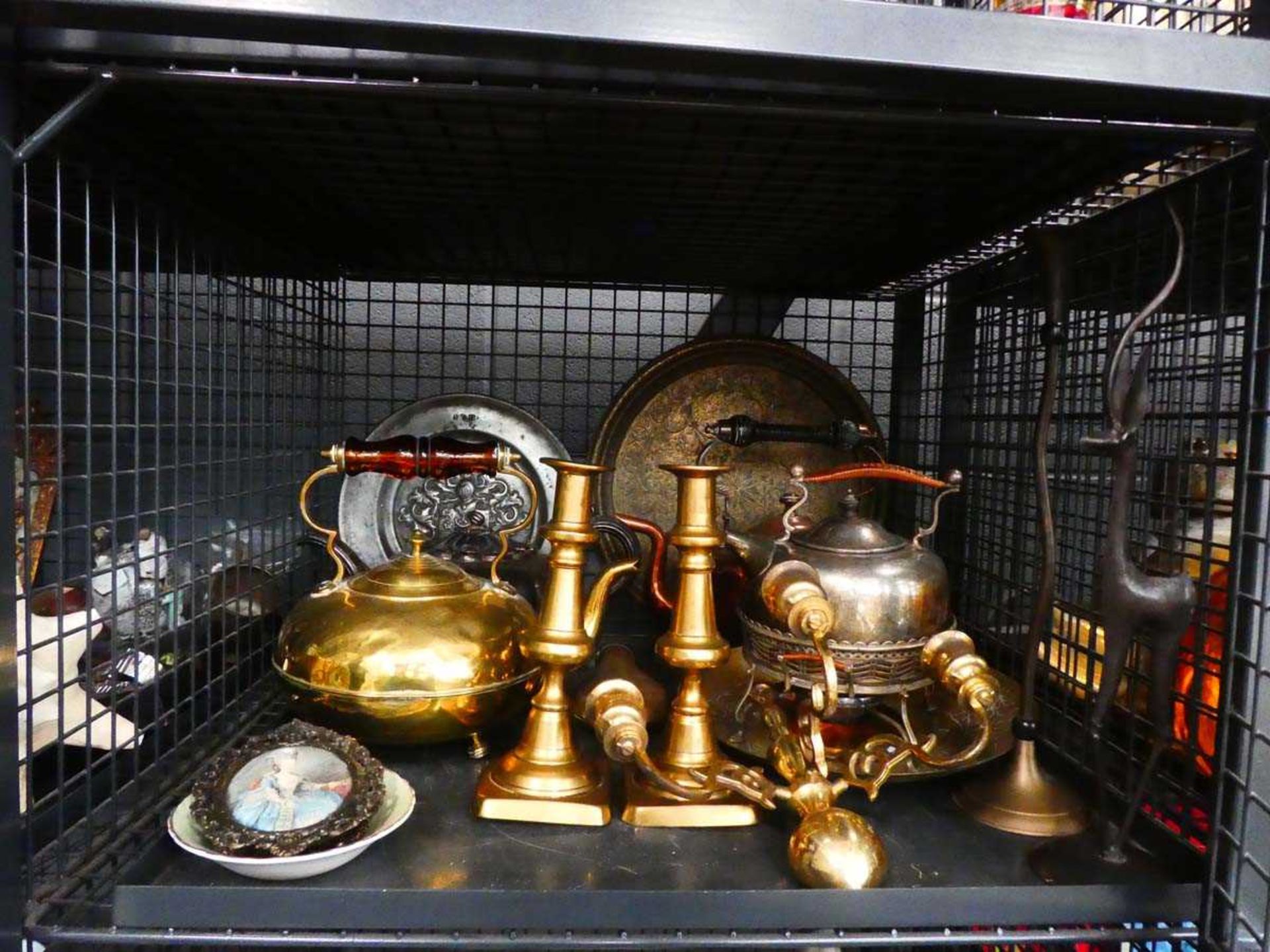 Cage containing spirit kettles, plus copper and brass kettles, candlesticks, and wall sconces