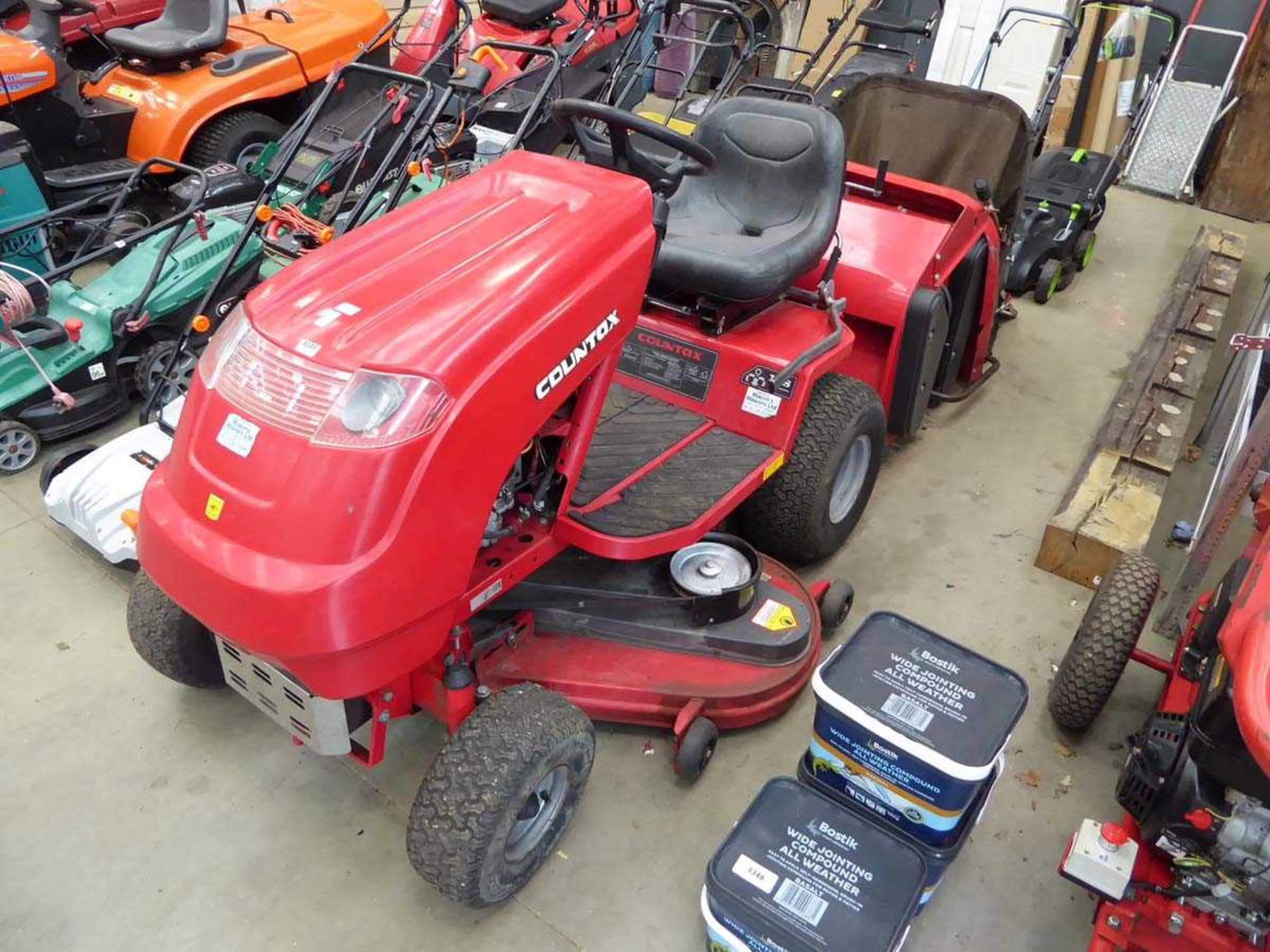 Countax C300M petrol powered ride on mower with grass collector and brush