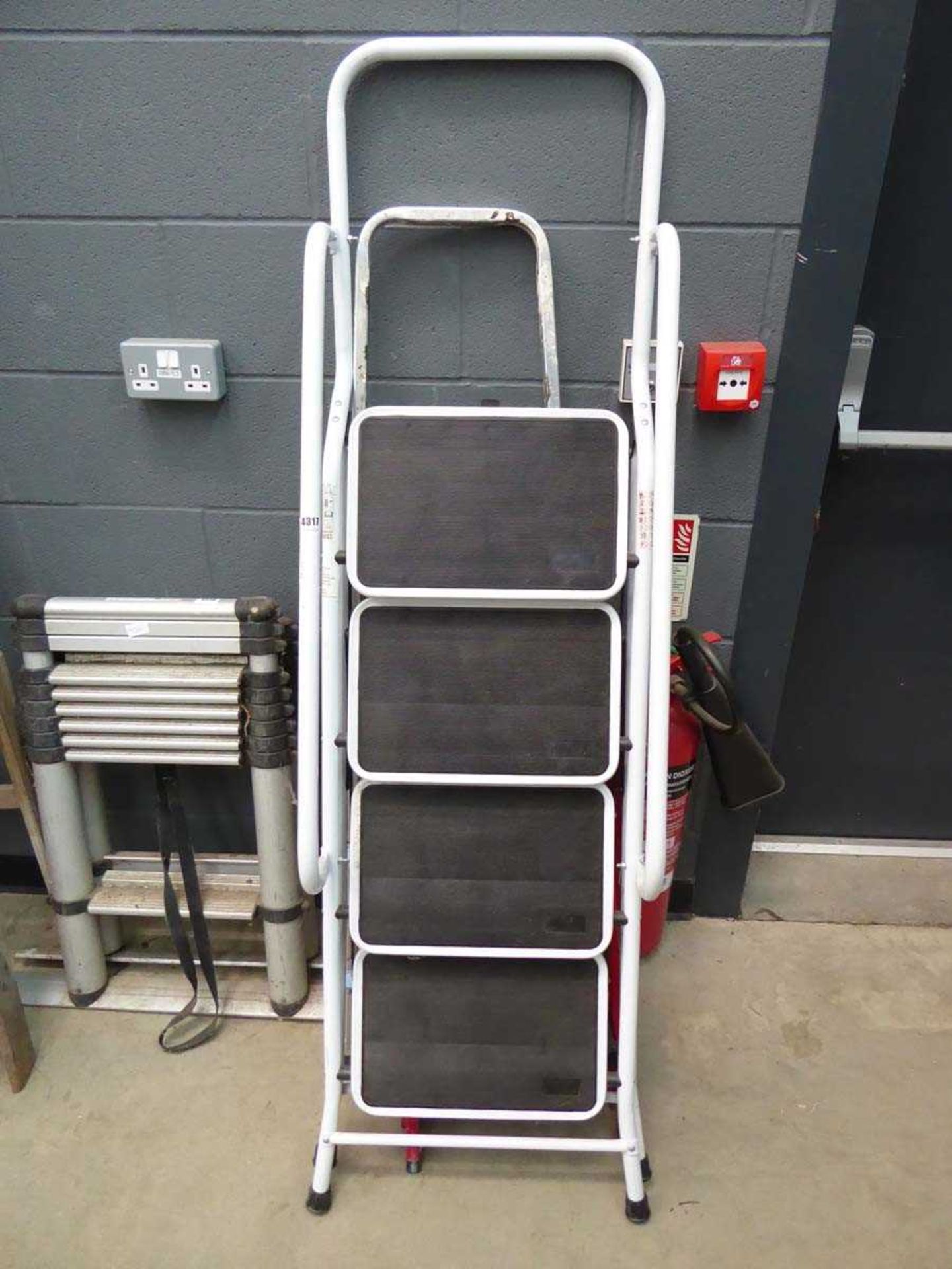 Set of white stepladders, small set of red steps, and set of aluminium steps