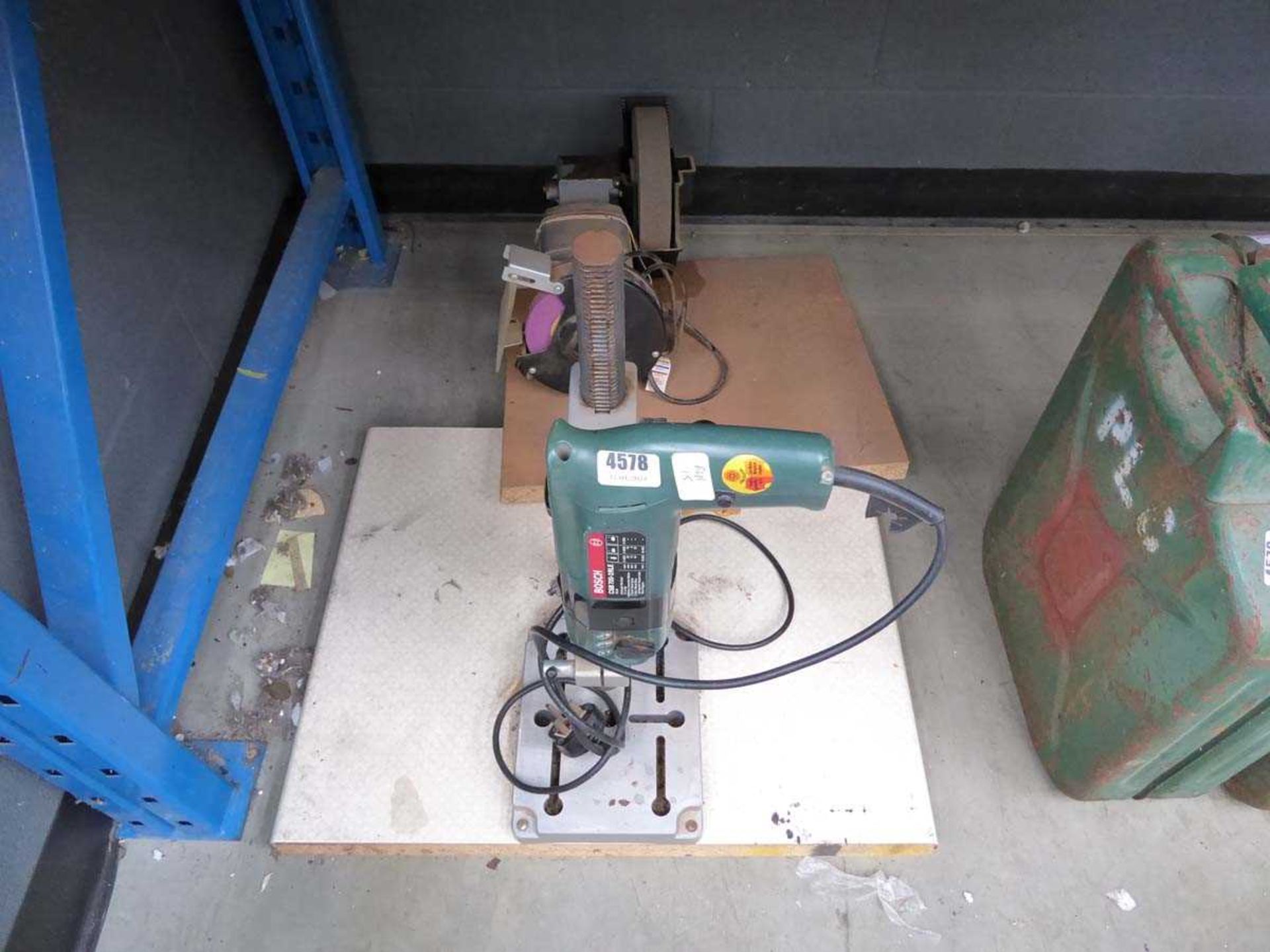 Double ended bench grinder, and Bosch drill on stand