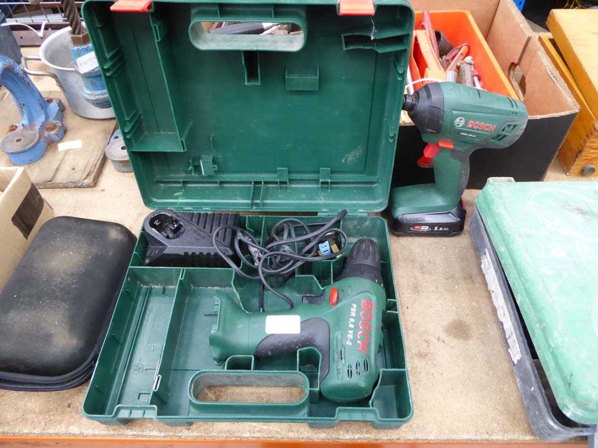 Bosch battery drill with charger, no batteries, and a small impact drive with battery, no charger