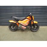 Small Blitz orange electric child's motorbike with charger