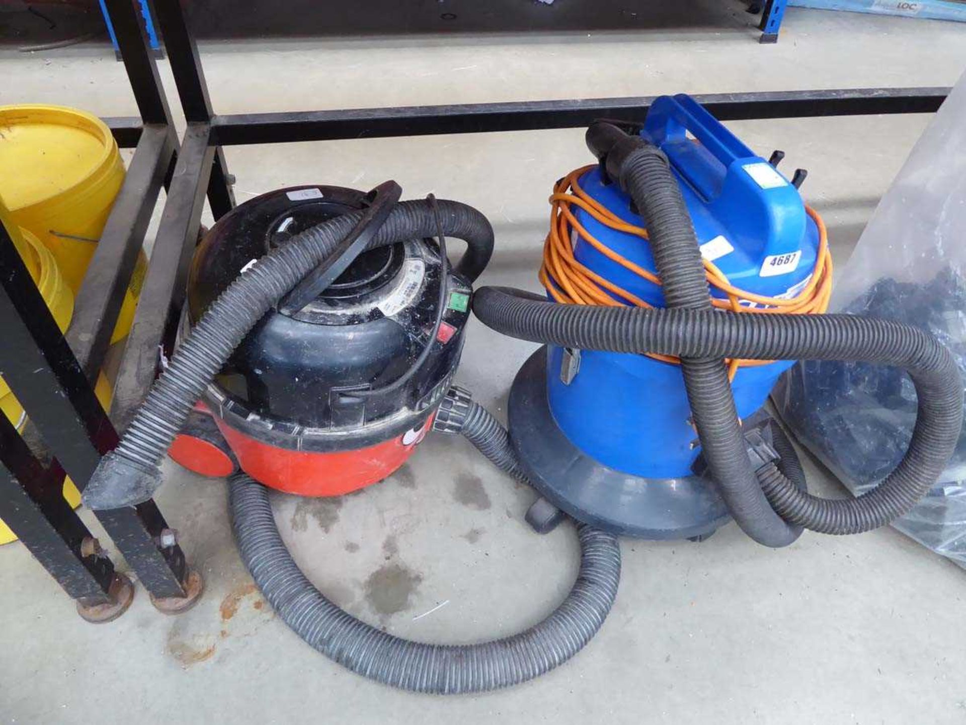 Henry vacuum cleaner and a blue vacuum cleaner