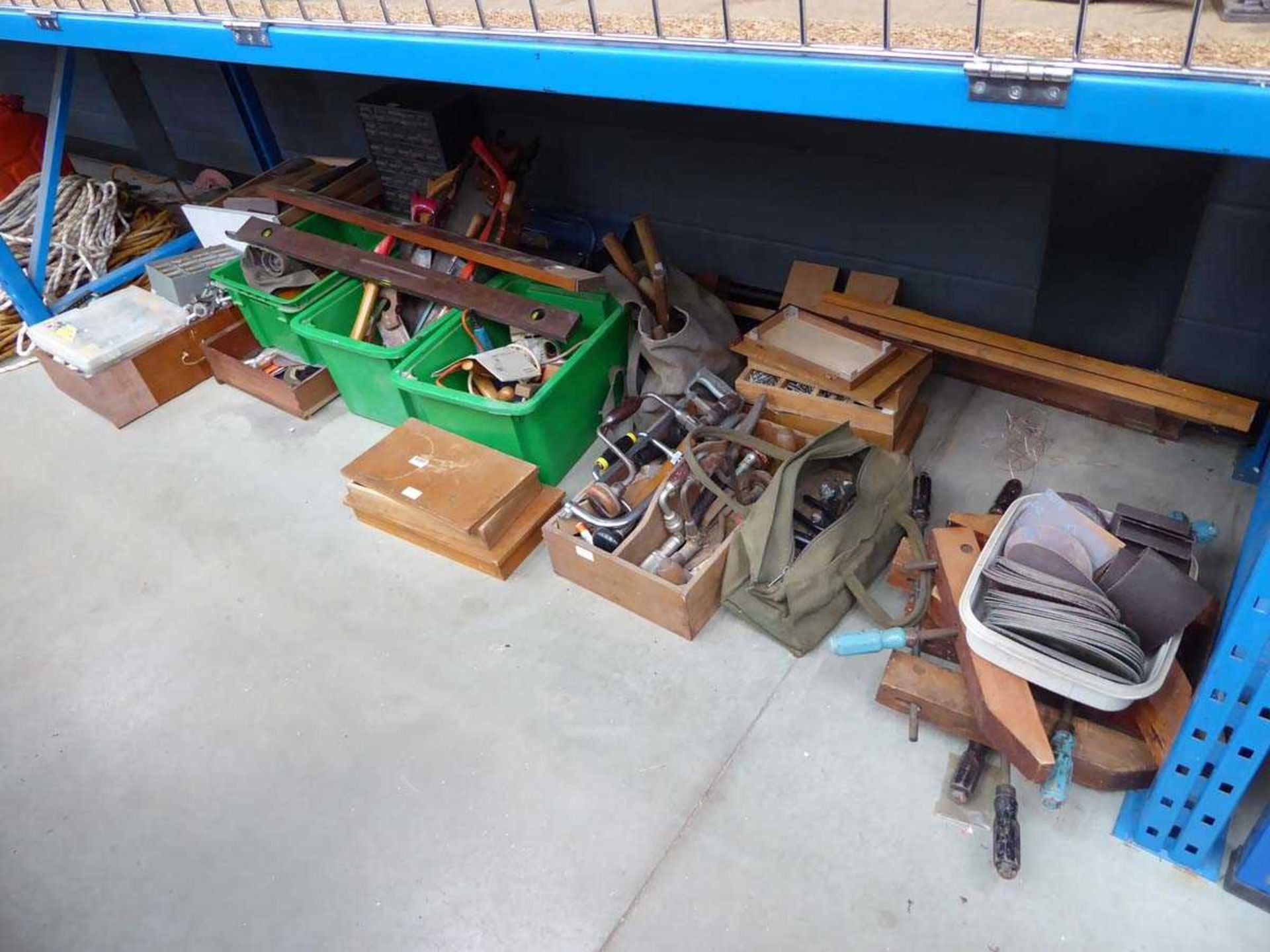 Large underbay containing chisels, hammers, drills, hand drills, sandpaper, clamps etc.