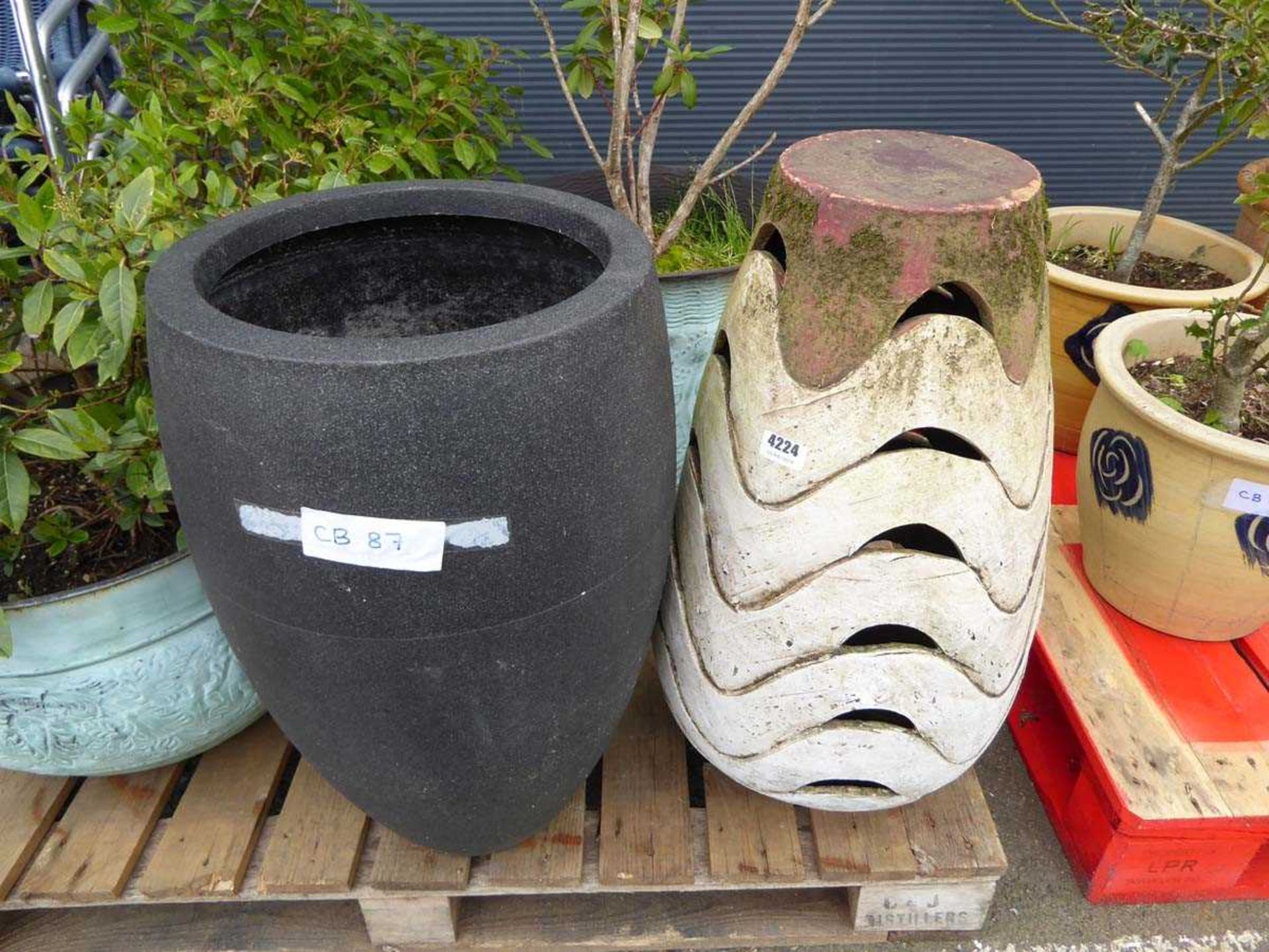 1 plastic grey pot and cone shaped ornament