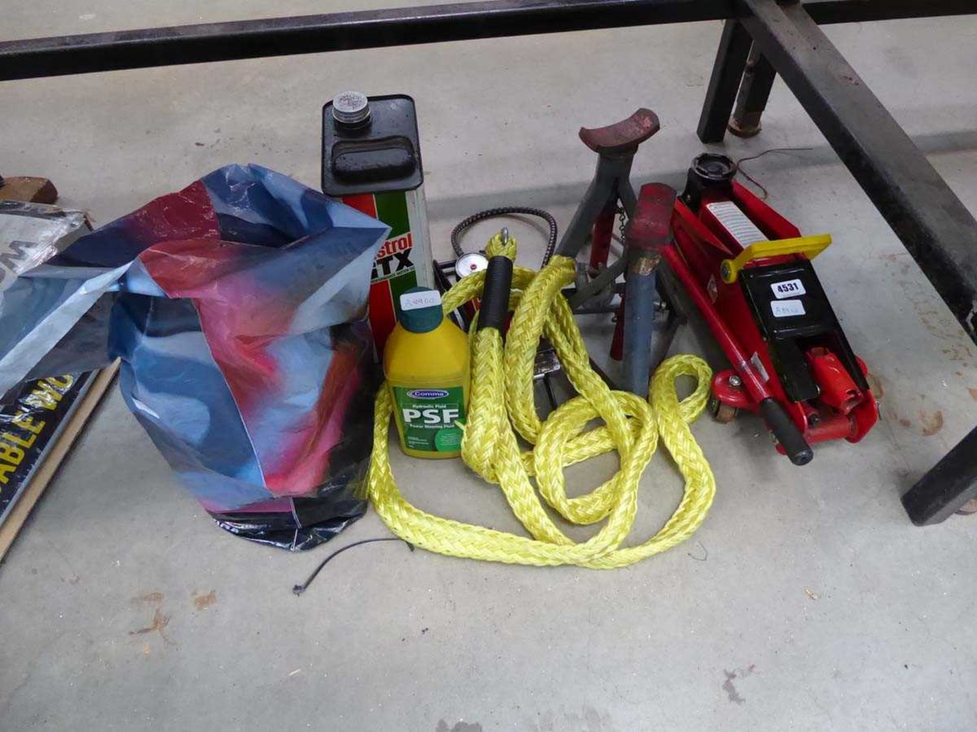 Bag containing Castrol GTX, hydraulic fluid, tow rope, jack and 2 axle stands