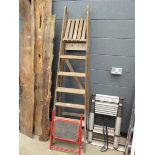 Small red single step and a wooden step ladder