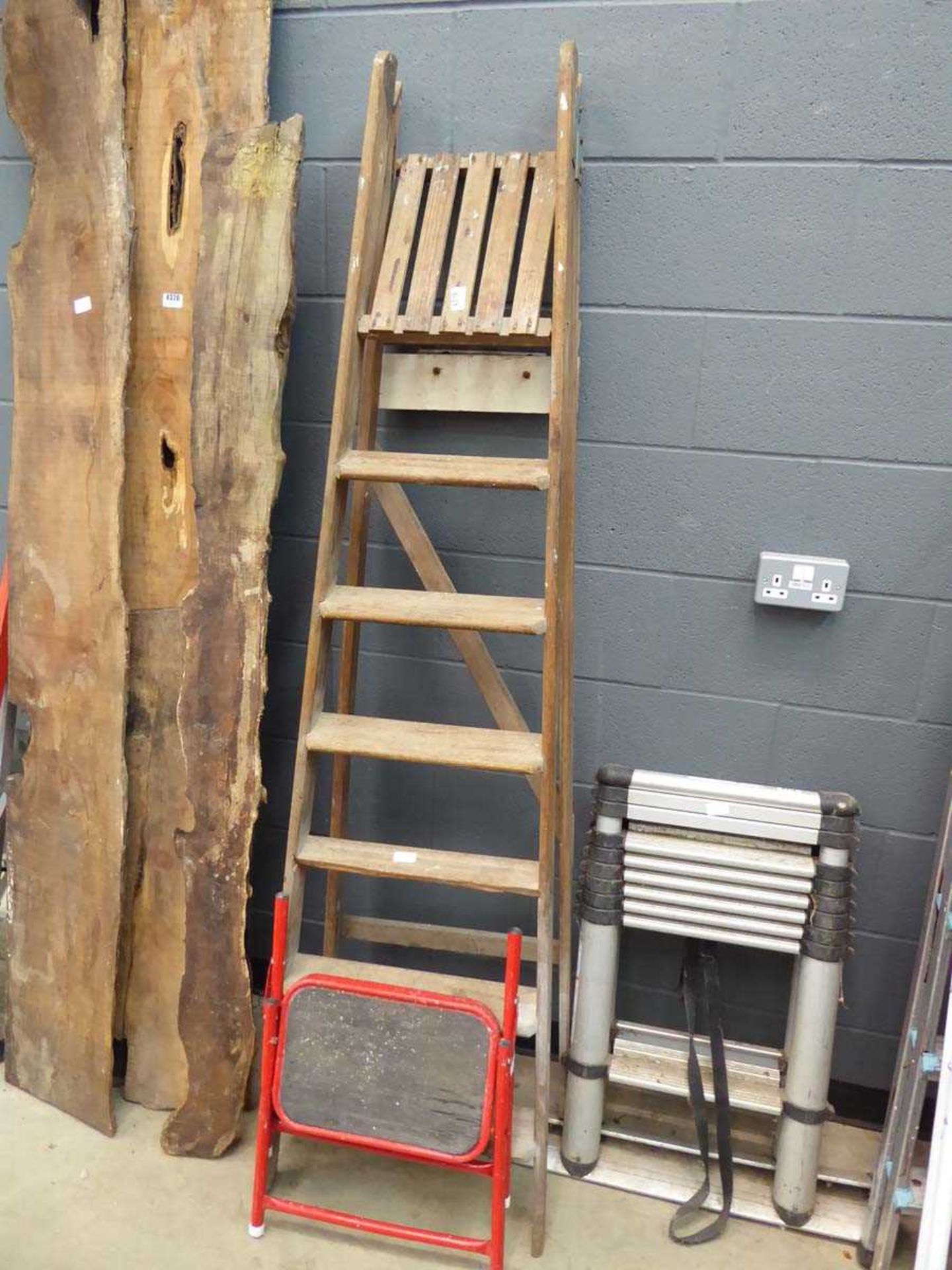 Small red single step and a wooden step ladder