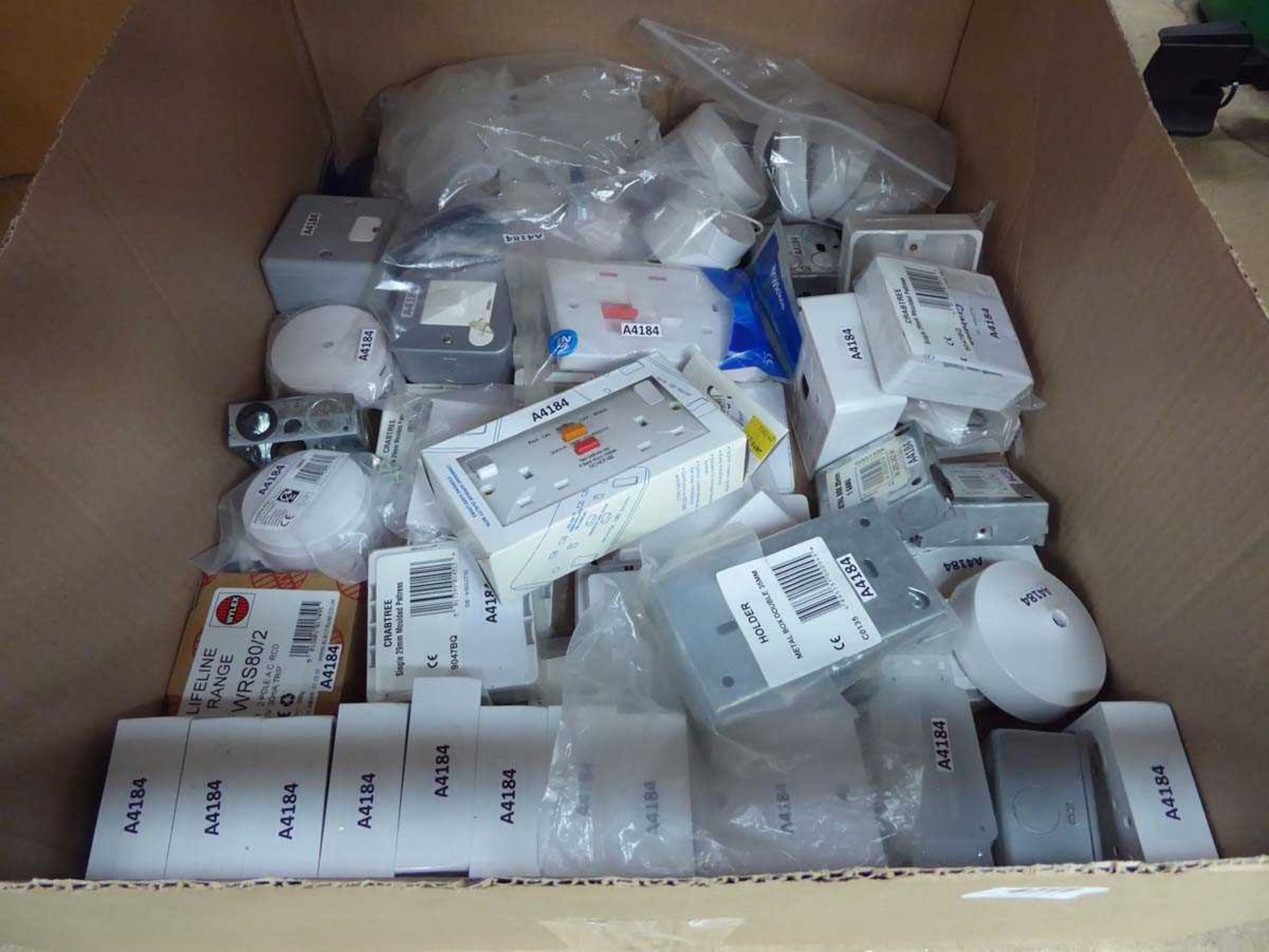 Box of assorted light switches, sockets, metal boxes etc