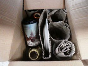 Box containing pint glasses and candlesticks
