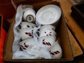 Box containing leaf patterned Denby crockery