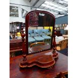 A Victorian mahogany swing mirror with two turned columns and a storage compartment, h. 80 cm