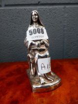 Silver plated figure of a nun