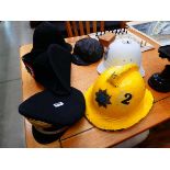 2 Italian military hats, firemans helmet, plus 2 pith helmets and 1 other