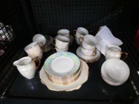 Cage containing Czech lustre ware part tea service