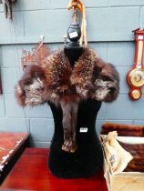 Female mannequin plus a fur stole