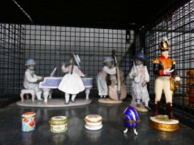Cage containing Halcyon Days pill boxes, plus Lladro and other figures Soldier figure is missing one