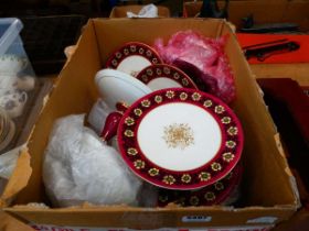 Box containing floral patterened cake stands