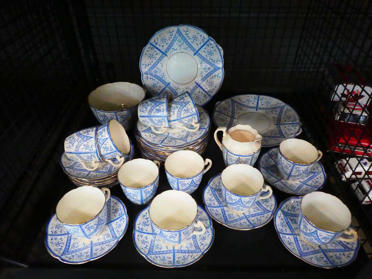 Cage containing a qty of blue and white floral patterned crockery