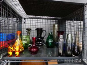 Cage of decanters, jugs and vases