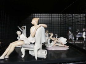 Cage containing a qty of Lladro ballerina and other figures The large figure is broken at the back