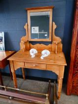 Stripped pine dressing table with swing mirror and drawer