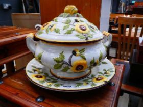 Large floral patterned soup tureen with ladle and dish under