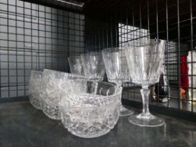 Cage containing wine glasses and dishes