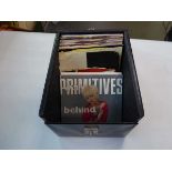 Box containing various vinyl singles inc. Paul Simon, The Housemartins etc.