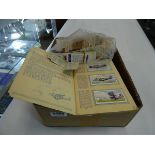 Box containing cigarette cards and albums