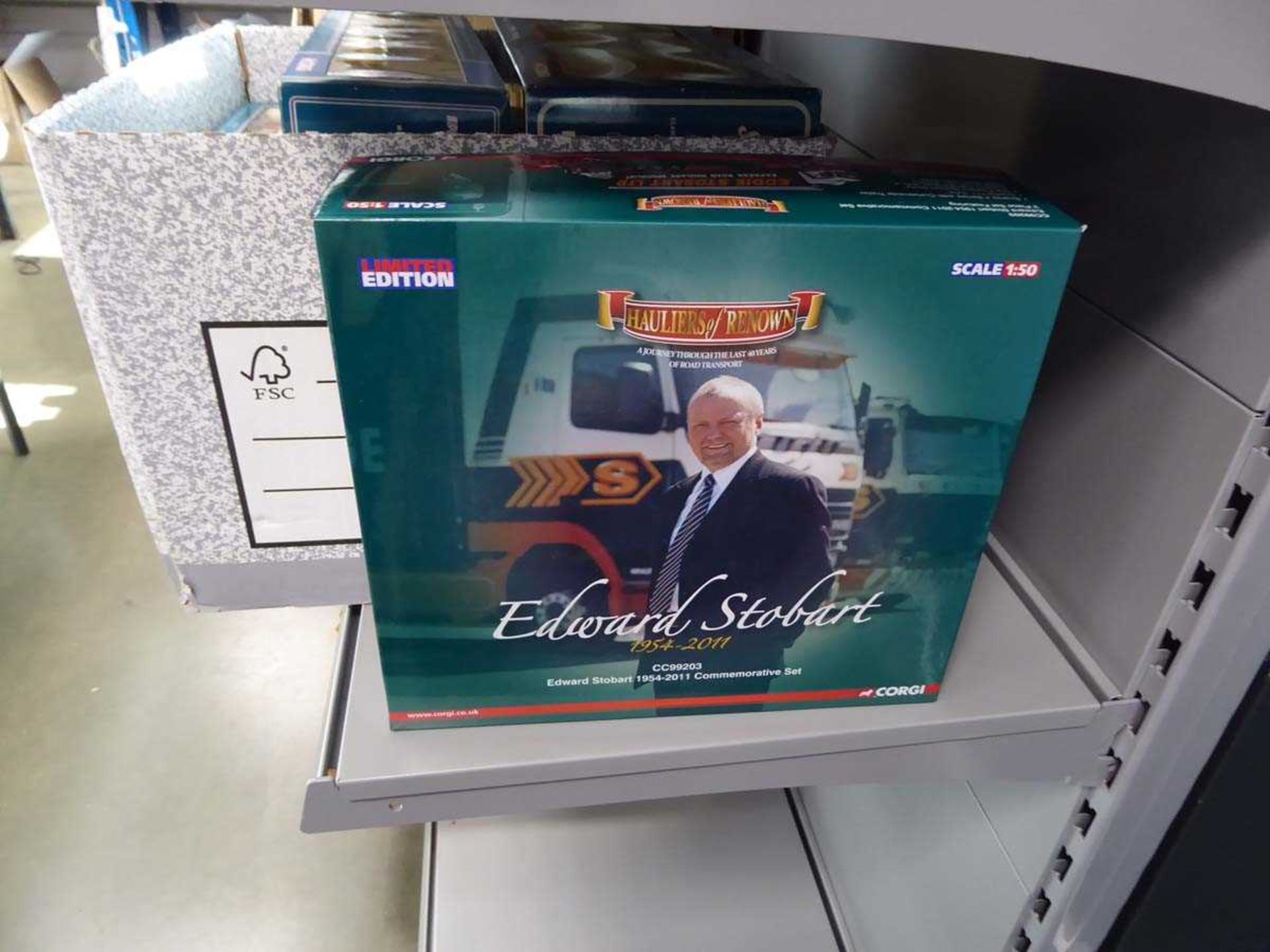 Box containing Corgi model trucks to include Eddie Stobart and others