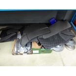 Half an underbay of car parts and accessories including mats, brake discs etc