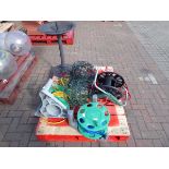Pallet containing plastic bird bath, hose pipe reels and mesh