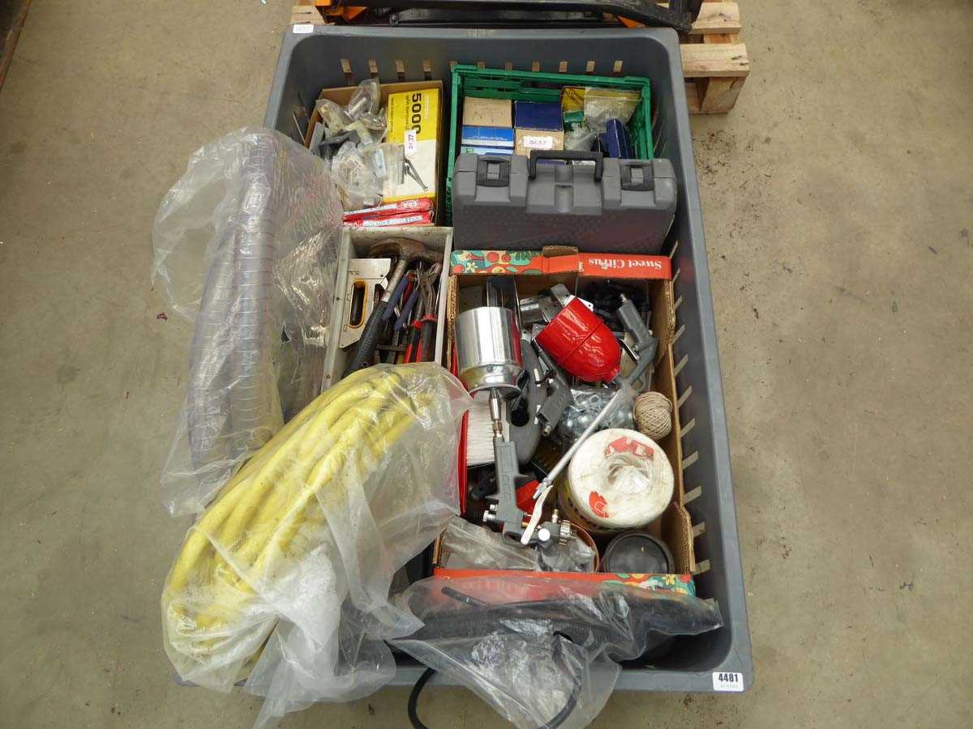 Large plastic crate containing tools, hose, spray equipment, locks etc