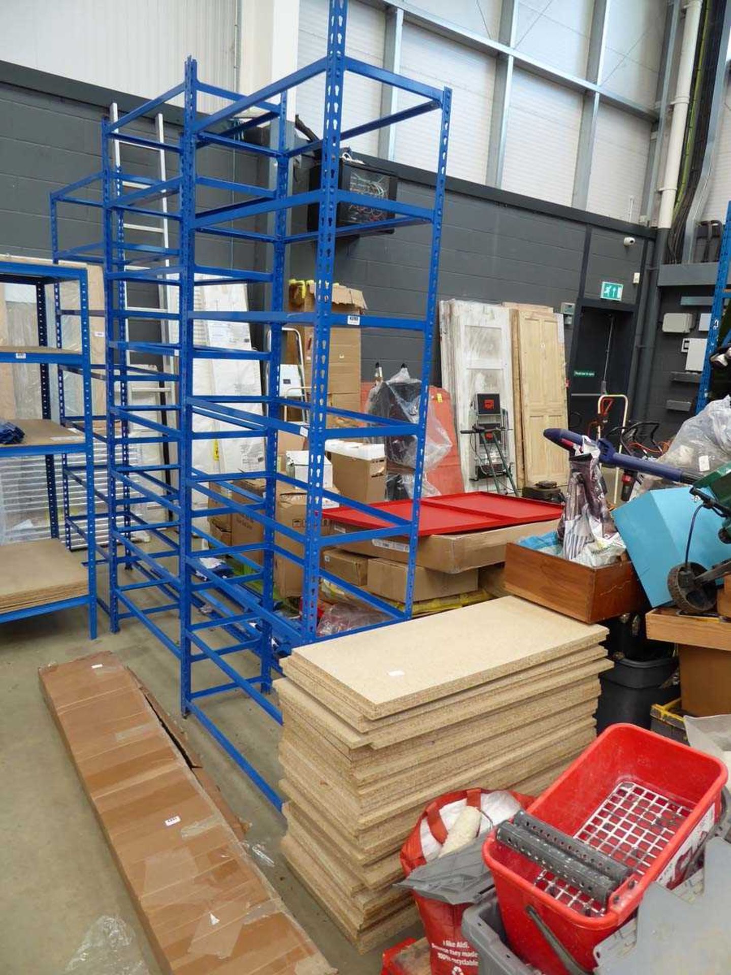 3 made-up bays, and 2 flatpack bays of blue high racking with chipboard shelves